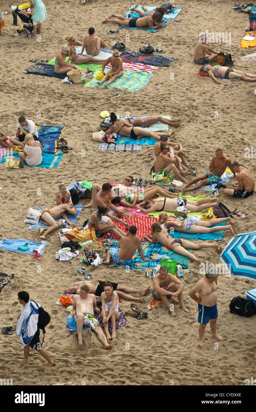 The Netherlands, Scheveningen, near The Hague or in Dutch: Den Haag. People sunbathing on the beach. Aerial view from pier. Stock Photo