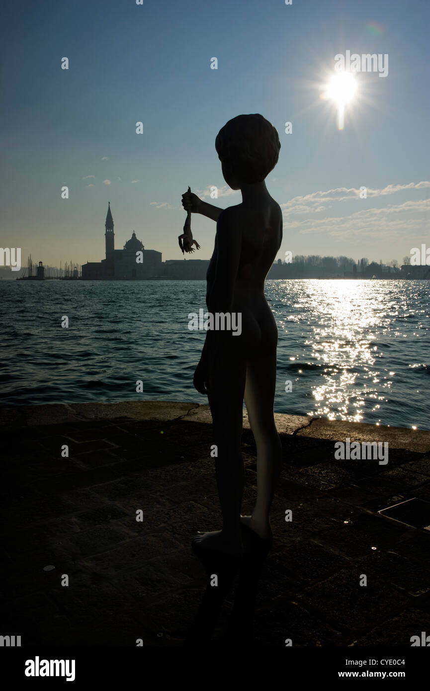 Silhouette of the 'boy with frog' sculpture, Venice, Veneto, Italy. Stock Photo