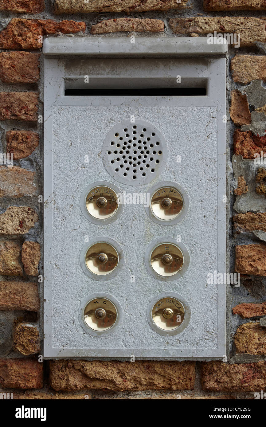 Six door bells in a panel outside a Venice apartment building Stock Photo