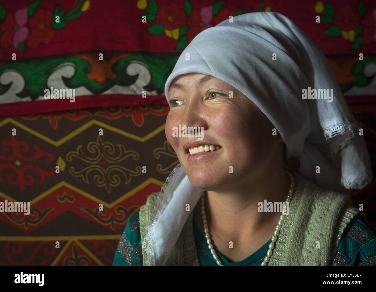 Smiling Kyrgyz Woman Near Karakul Lake, Xinjiang Uyghur Autonomous Region, China Stock Photo