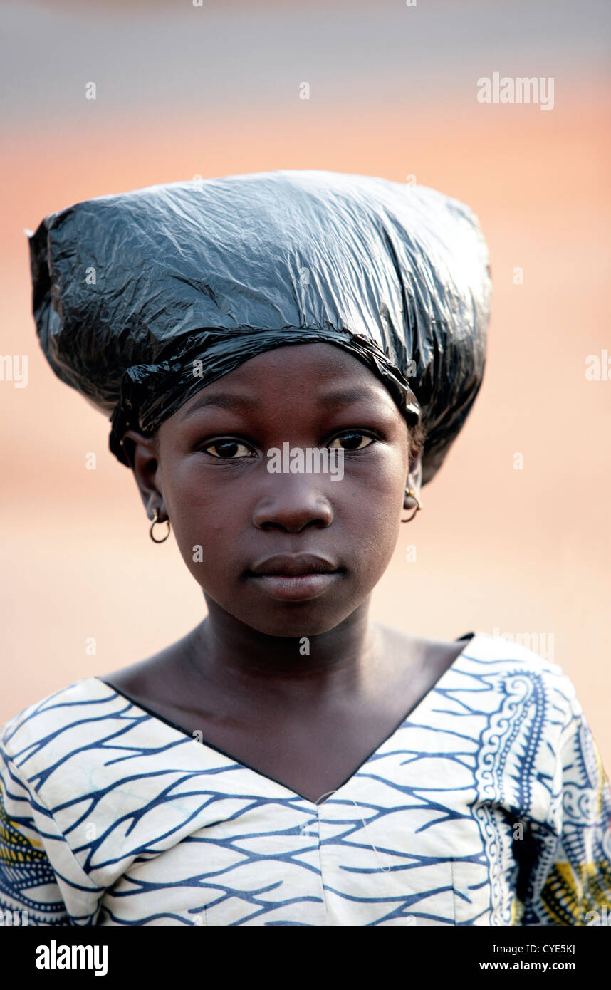 Young girl with plastic bag on her hair Stock Photo - Alamy