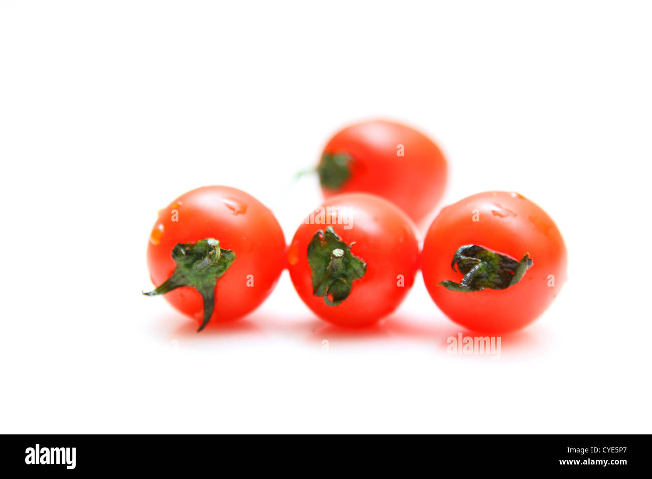 Cherry tomatoes isolated on white background Stock Photo - Alamy