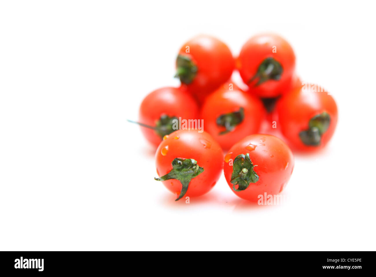 Cherry tomatoes isolated on white background Stock Photo - Alamy