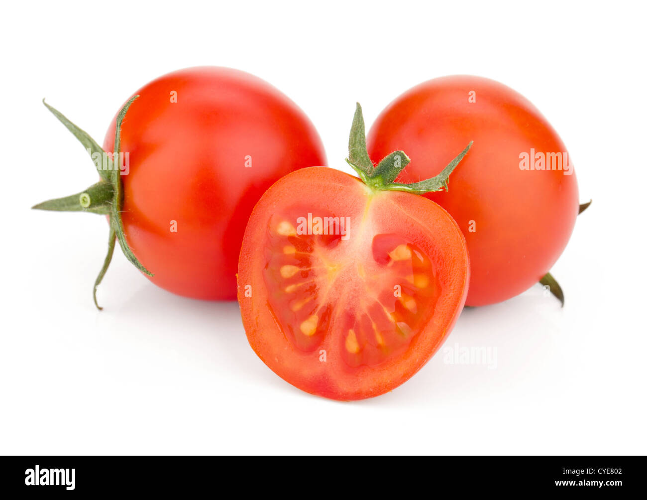 Three cherry tomatoes. Isolated on white background Stock Photo
