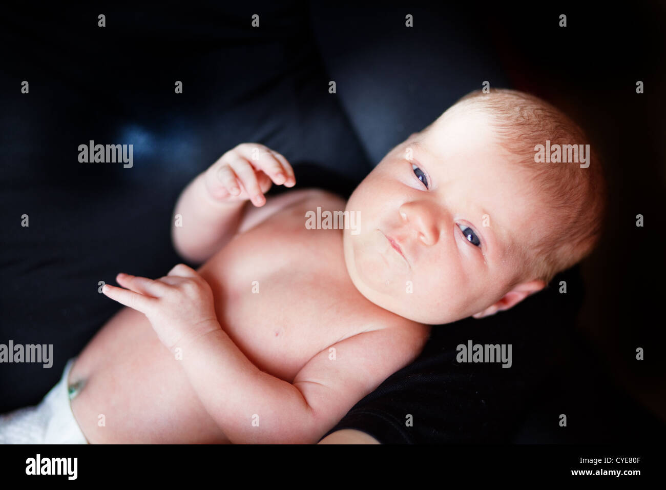 Baby on mother hands Stock Photo