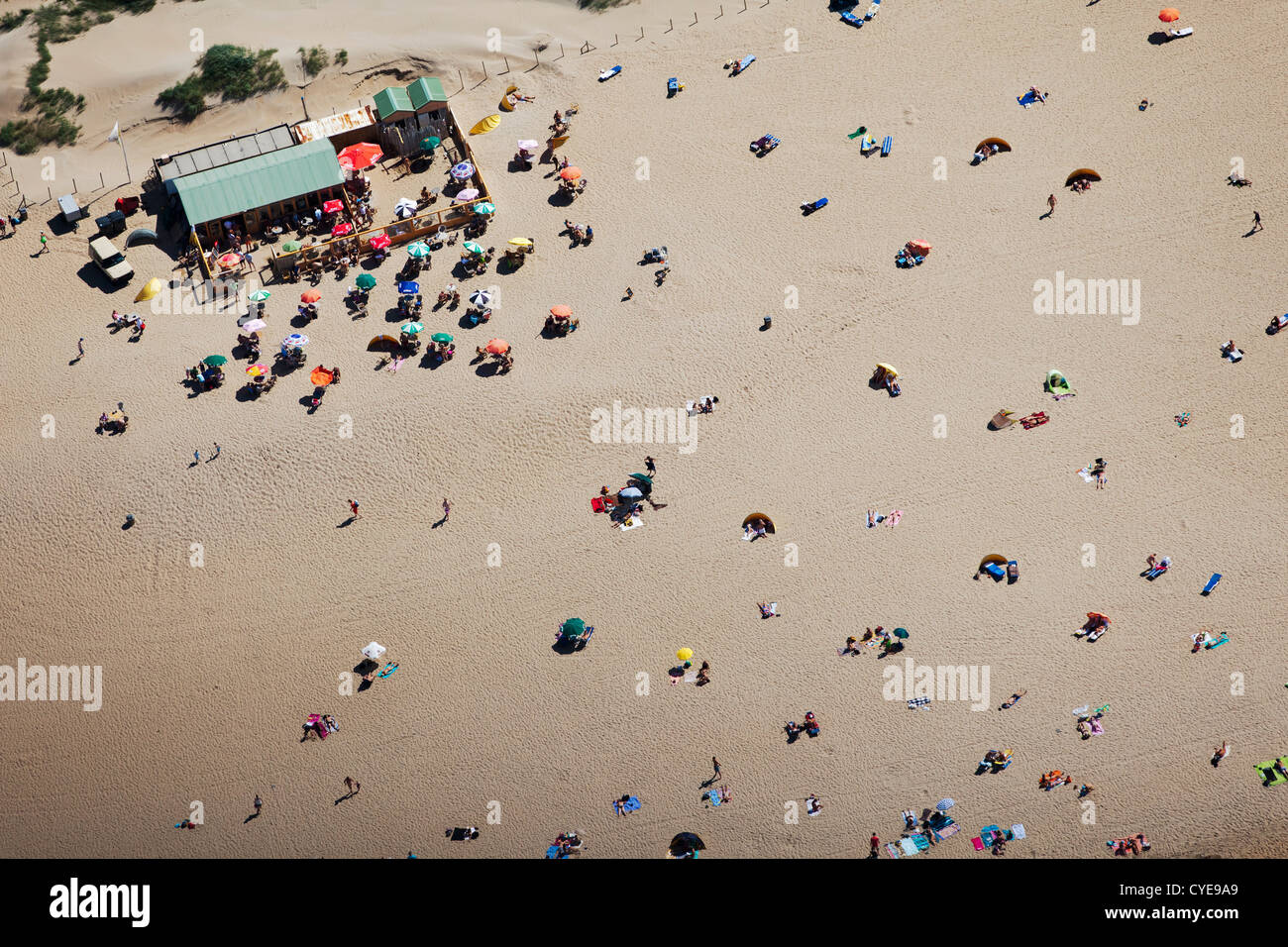 The Netherlands, Scheveningen, near The Hague or in Dutch: Den Haag. People sunbathing on the beach. Summertime. Aerial Stock Photo