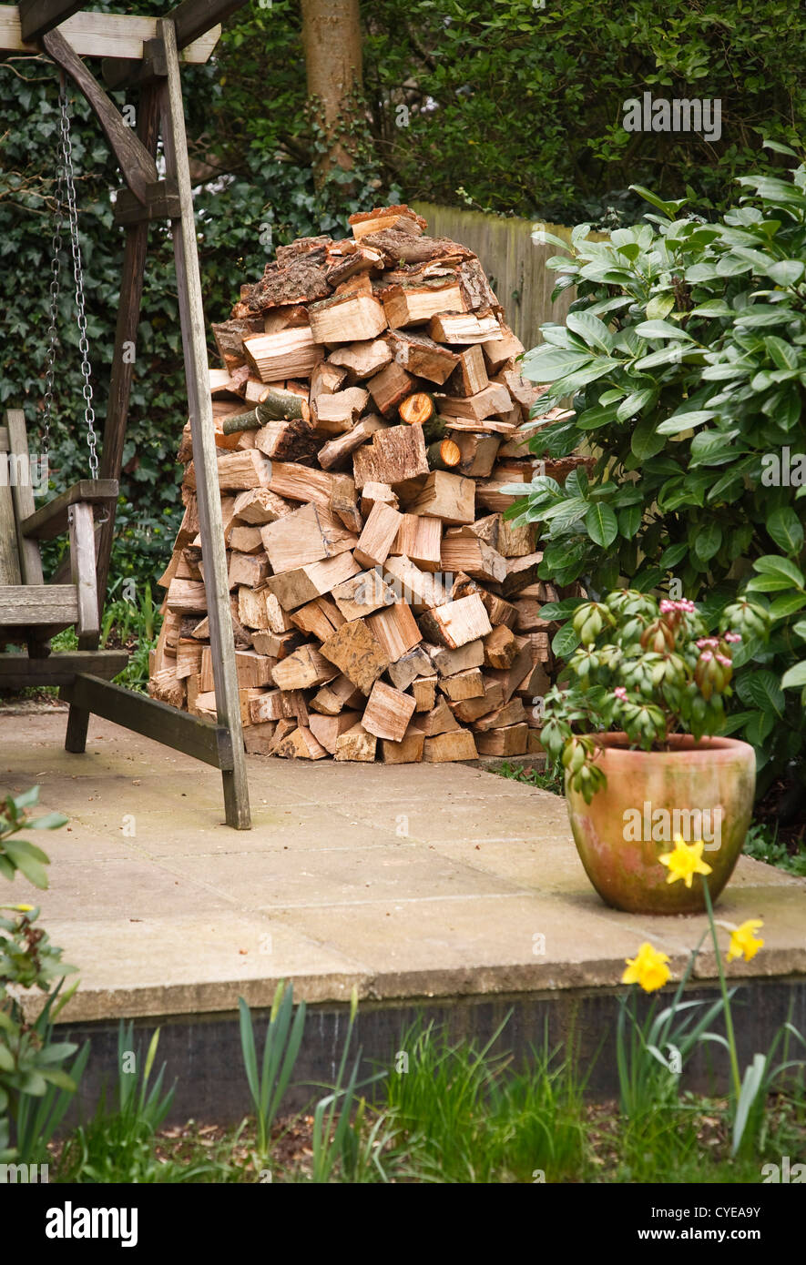 Circular wood stack or holz hausen with oak firewood seasoning in a garden Stock Photo Alamy