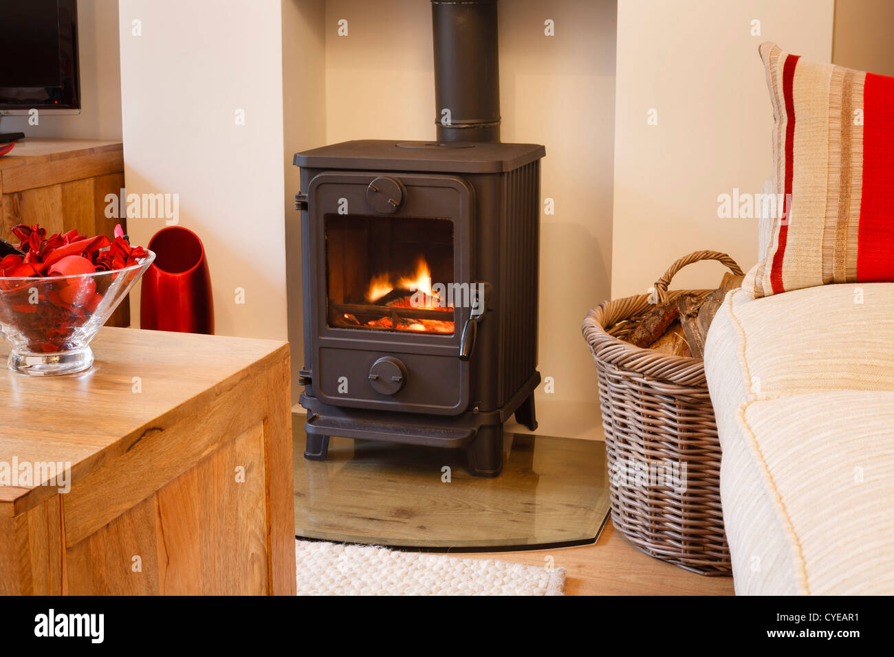 Cozy modern interior living room with wood burner Stock Photo