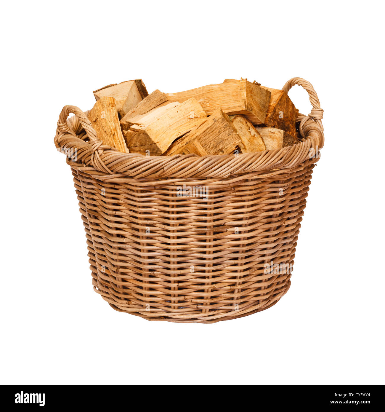 Traditional wicker log basket with oak logs isolated against a white background Stock Photo