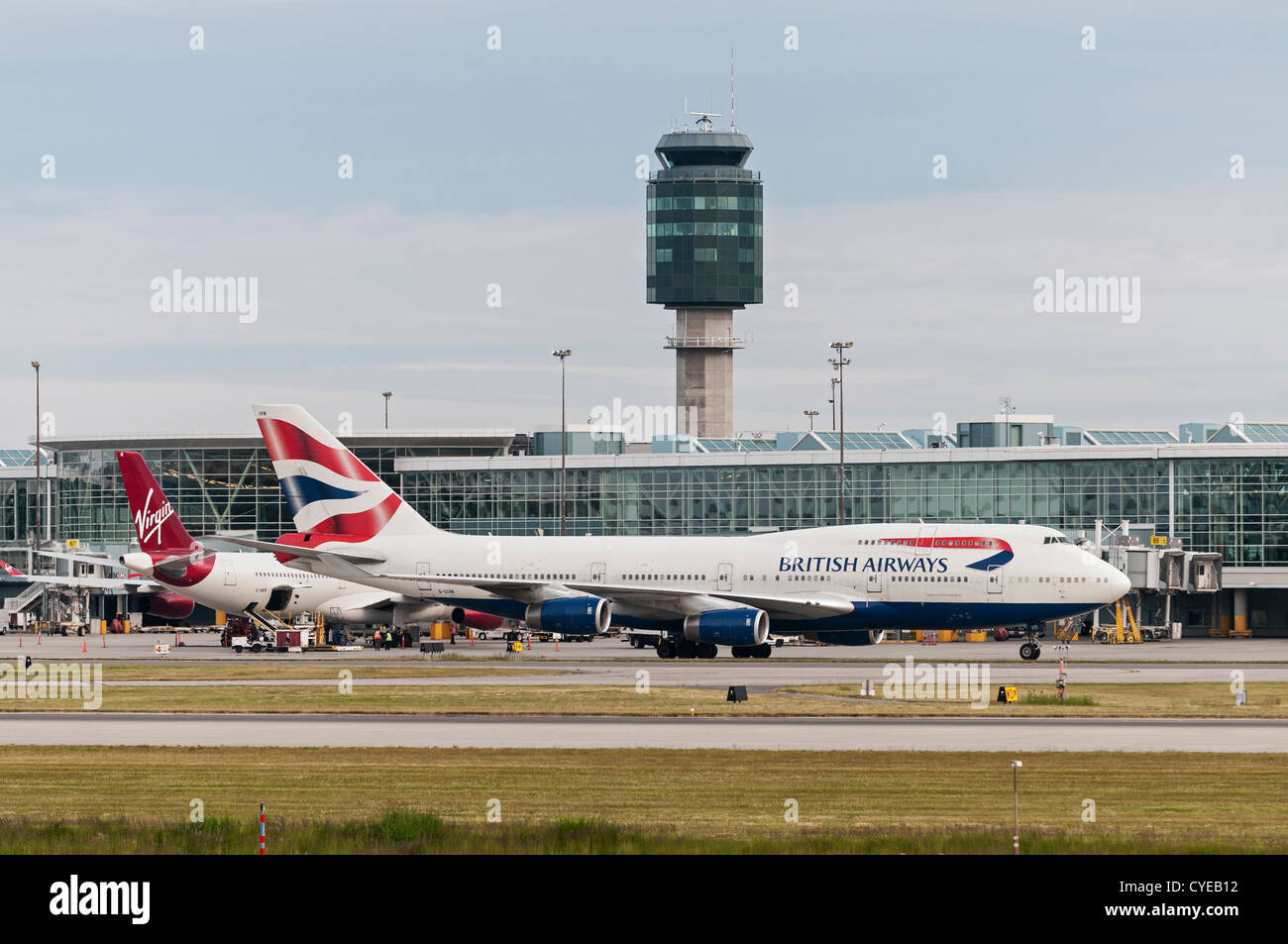 British Airways (BA) and Virgin Atlantic Airways passenger jets at Vancouver International Airport, Canada. Stock Photo