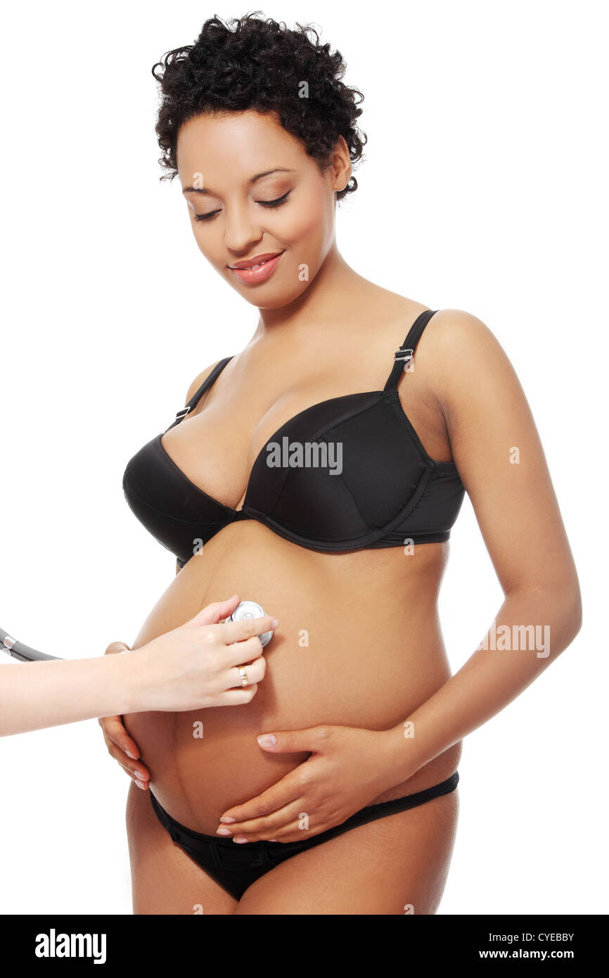Pleased pregnant woman dressed in black lingerie Stock Photo - Alamy