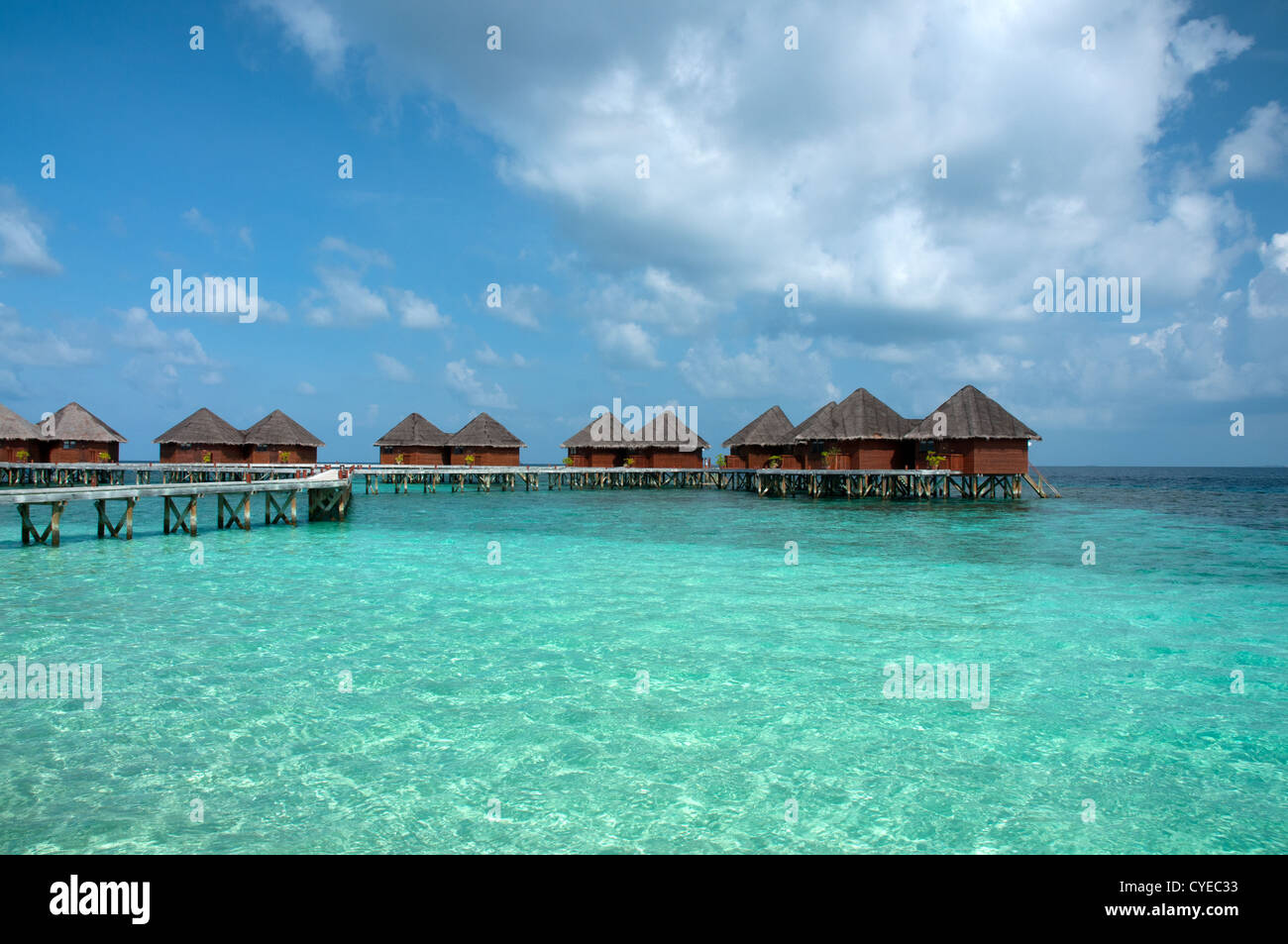 Overwater bungalows in beautiful blue lagoon, Maldives Stock Photo