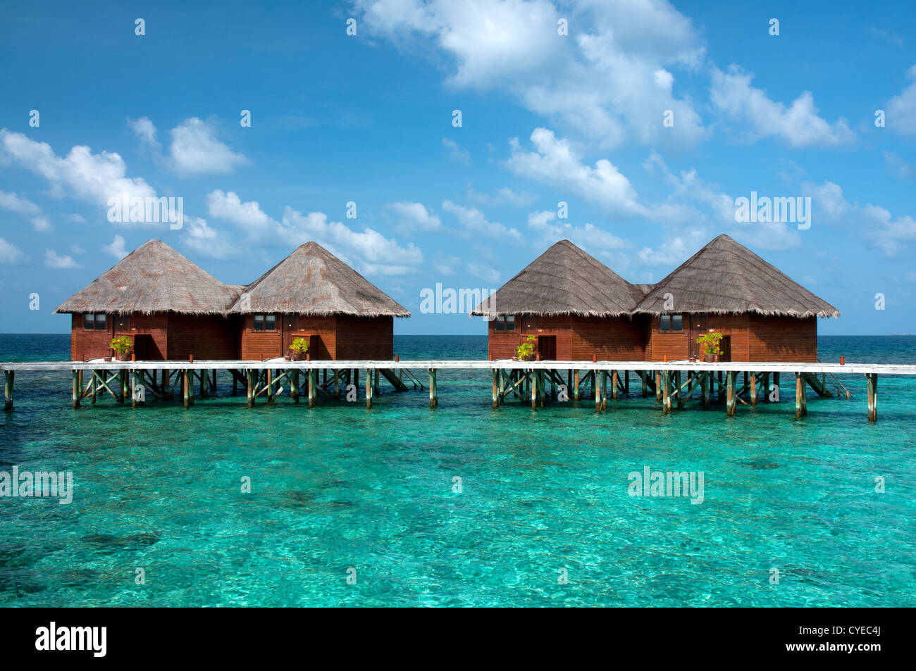 Overwater bungalows in beautiful blue lagoon, Maldives Stock Photo