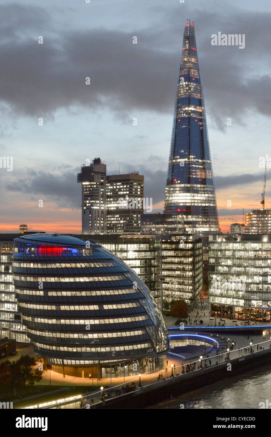 London skyline (L- R) City Hall "More London" with The Scoop Guys NHS Hospital & The Shard riverside office lights dusk sunset copyspace England UK Stock Photo