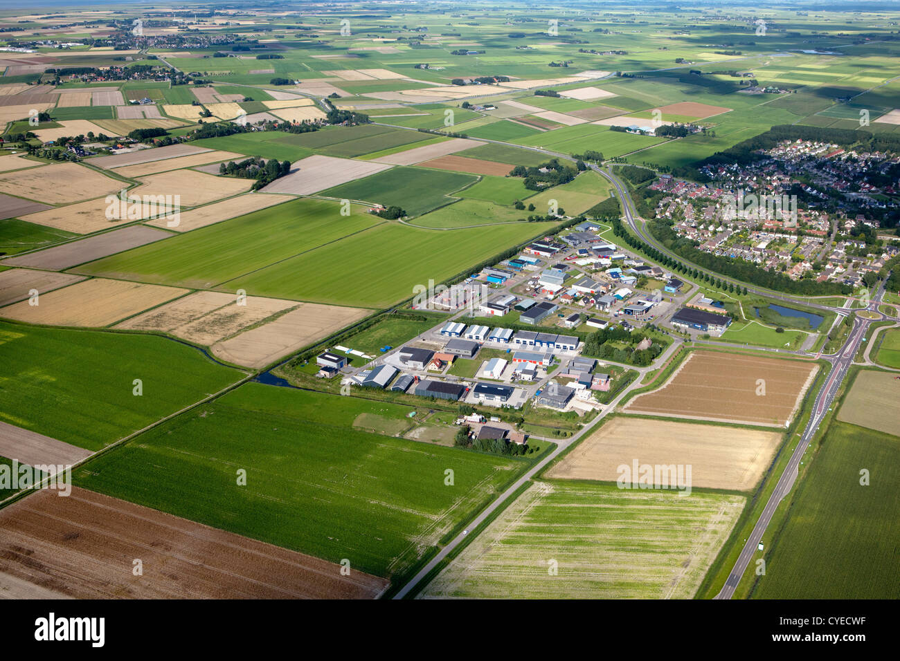 The Netherlands, near Stiens, Industrial district, farms and farmland. Aerial. Stock Photo