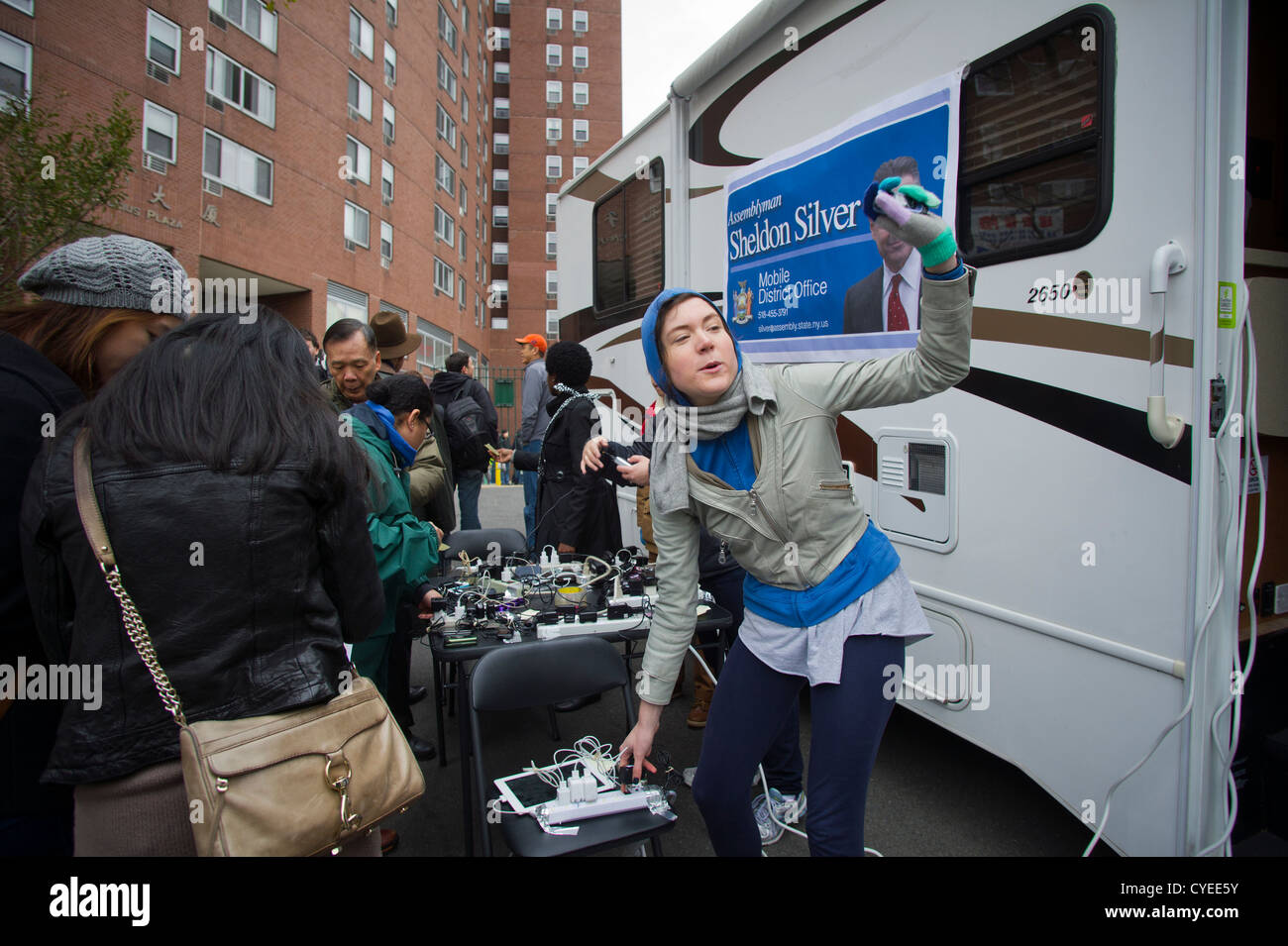 People charging their cell phones in Chinatown in New York Stock Photo Alamy