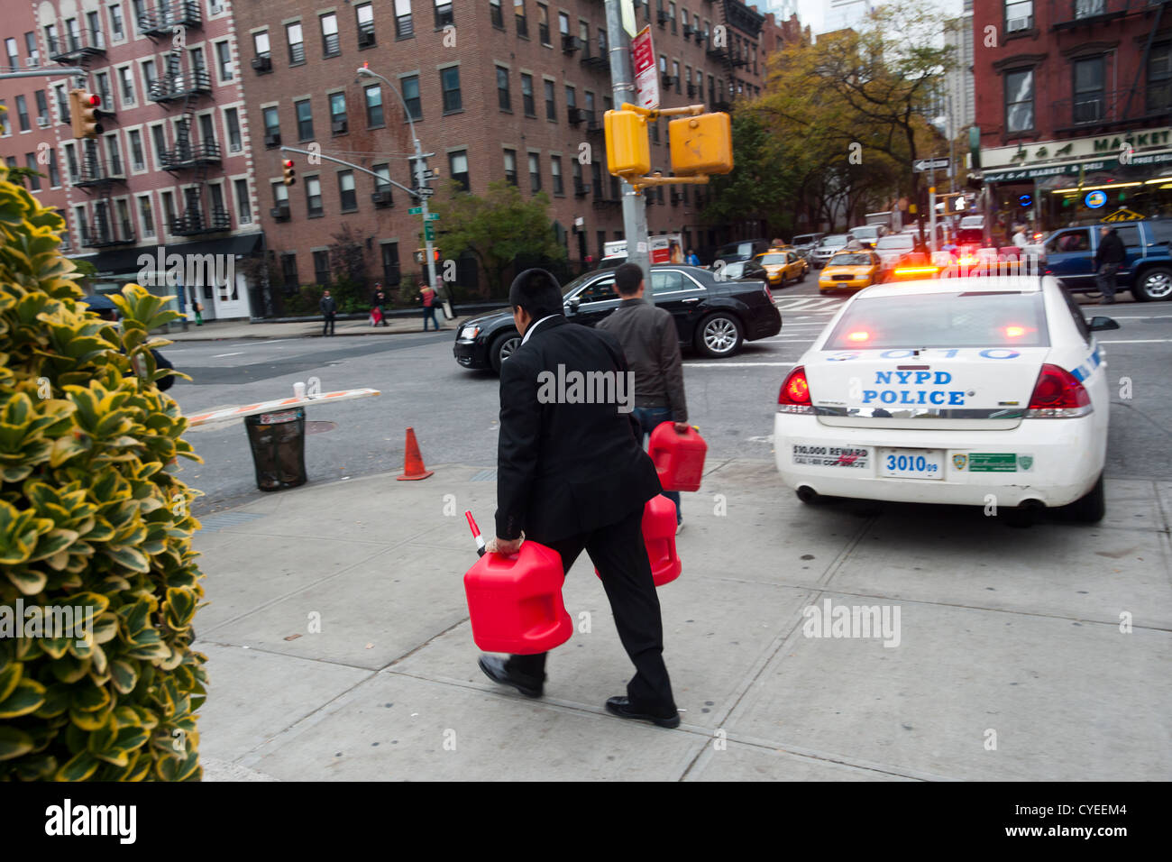 People line up to buy gasoline at a Hess gas station in the Clinton neighborhood of Manhattan in New York Stock Photo