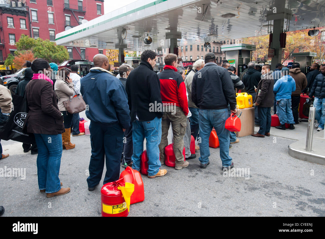People line up to buy gasoline at a Hess gas station in the Clinton