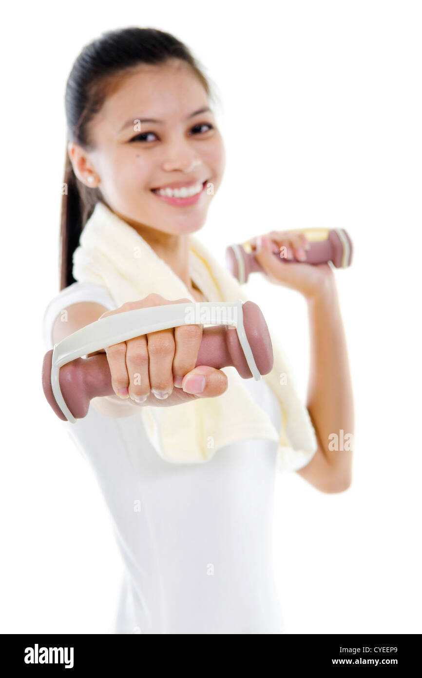 Portrait of fitness woman working out with free weights in studio Stock Photo Alamy