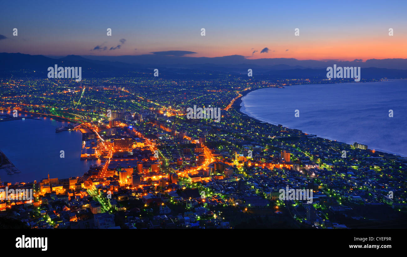 The dawn sky over the reknown view of Hakodate, Japan. The city was the first in Japan to open its ports to trade in 1854. Stock Photo