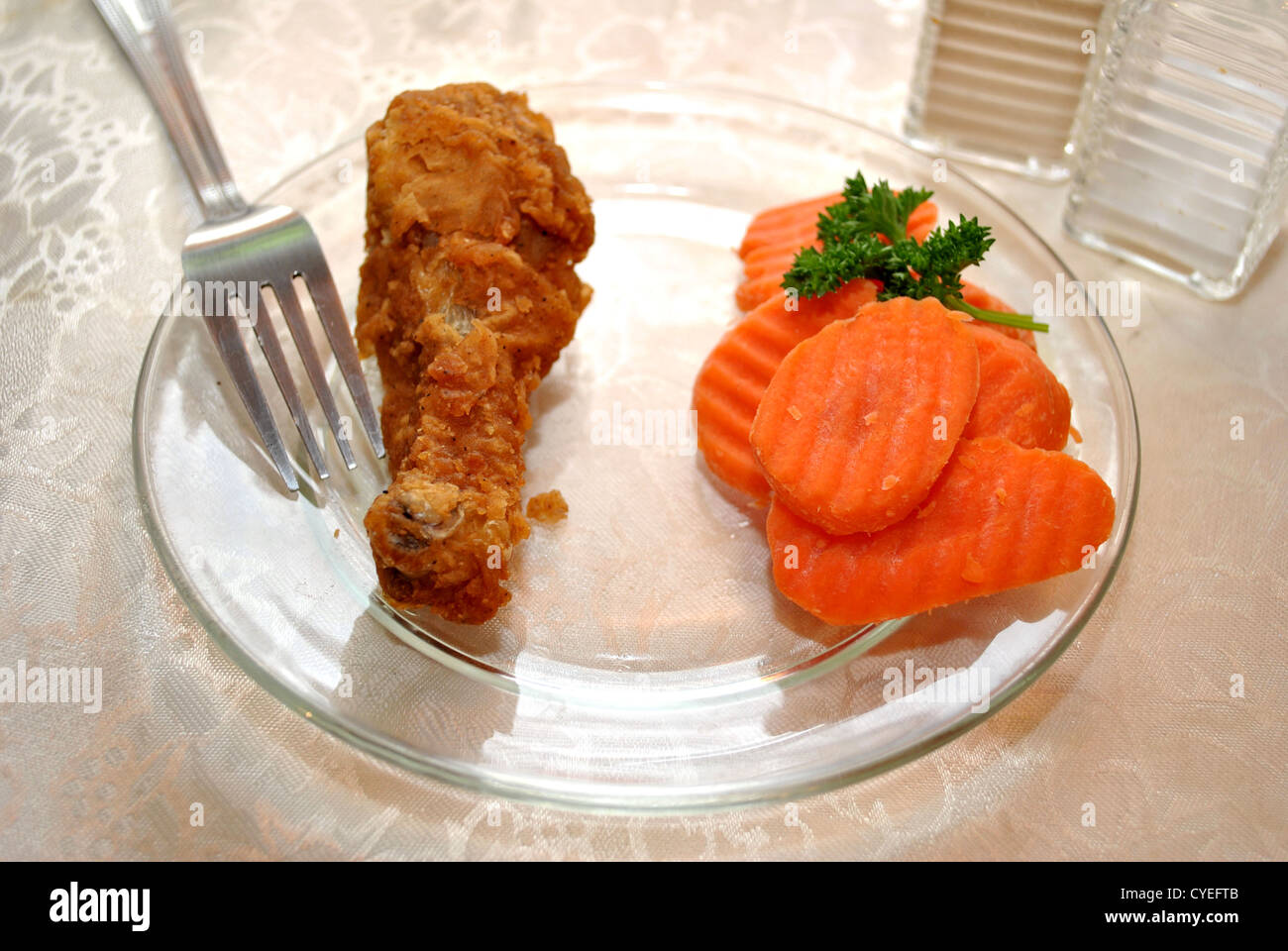 Unhealthy Fried Chicken with Healthy Sliced Carrots Stock Photo Alamy