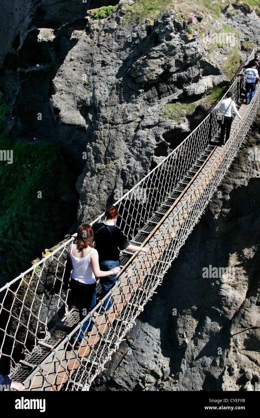 Moving Rope Bridge People moving along rope bridge, Carrick-a-Rede, North Ireland Stock ...