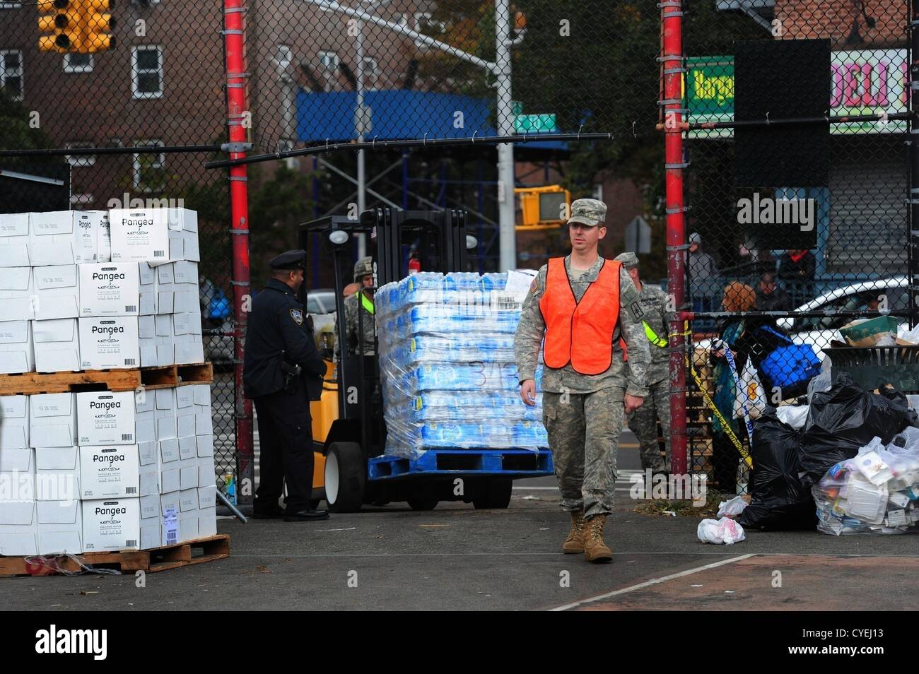 Nov. 2, 2012 - Manhattan, New York, U.S. - Members of the Air National Guard Unit 105th out of Stewart Air Force Base with community volunteers deliver and distribute food, water, toiletries, cleaning supplies and other goods to residents in the East Village at a distribution center at Vladic Palyground on East 10th Street between Avenue C and Avenue D near the ConEd plant on East 14th Street this afternoon following the effects of Hurricane Sandy in New York, November 2, 2012. (Credit Image: © Bryan Smith/ZUMAPRESS.com) Stock Photo