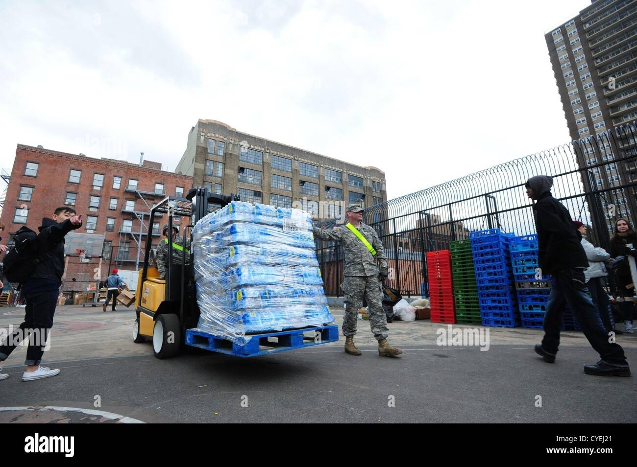 Nov. 2, 2012 - Manhattan, New York, U.S. - Members of the Air National Guard Unit 105th out of Stewart Air Force Base with community volunteers deliver and distribute food, water, toiletries, cleaning supplies and other goods to residents in the East Village at a distribution center at Vladic Palyground on East 10th Street between Avenue C and Avenue D near the ConEd plant on East 14th Street this afternoon following the effects of Hurricane Sandy in New York, November 2, 2012. (Credit Image: © Bryan Smith/ZUMAPRESS.com) Stock Photo