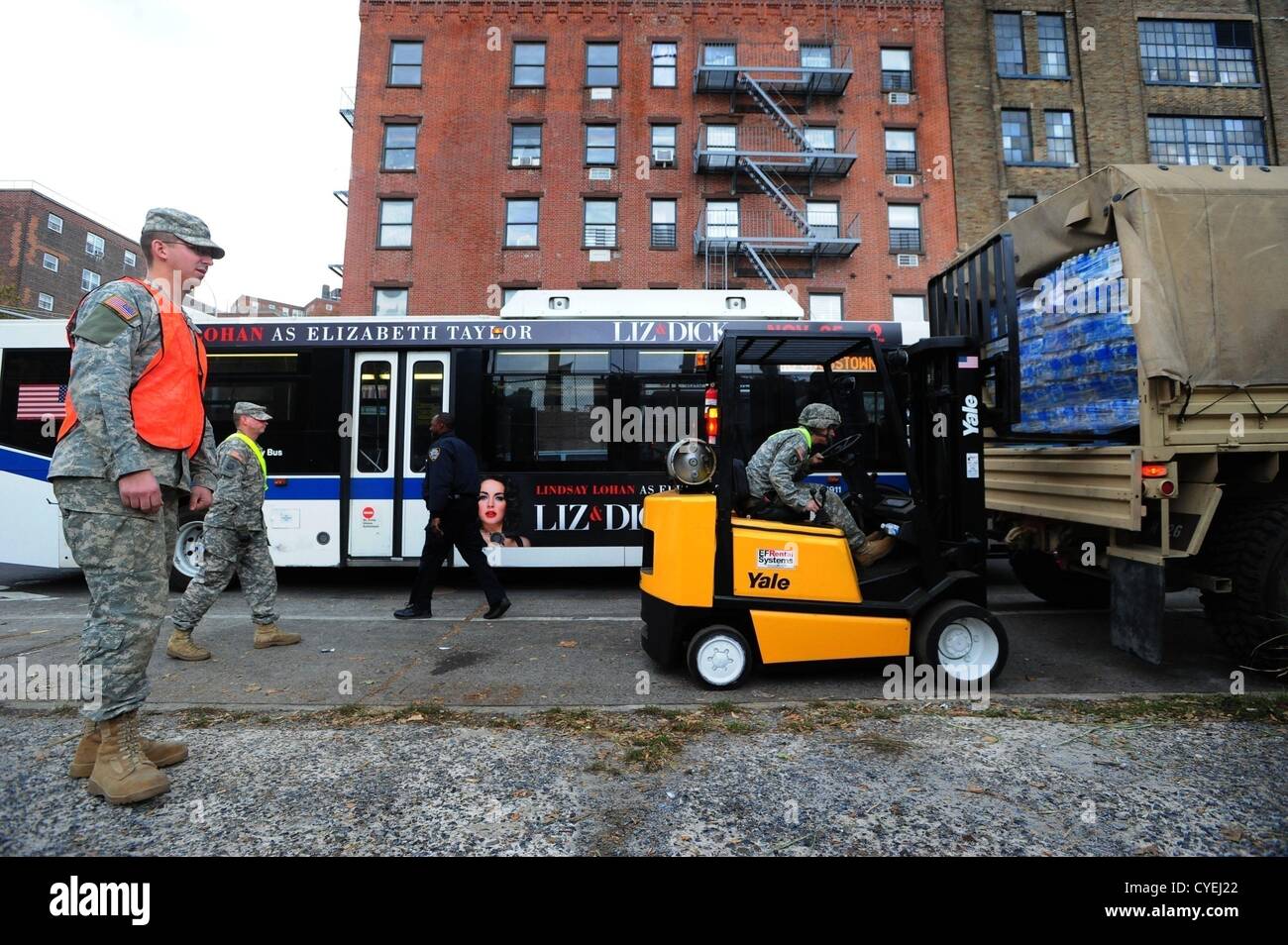 Nov. 2, 2012 - Manhattan, New York, U.S. - Members of the Air National Guard Unit 105th out of Stewart Air Force Base with community volunteers deliver and distribute food, water, toiletries, cleaning supplies and other goods to residents in the East Village at a distribution center at Vladic Palyground on East 10th Street between Avenue C and Avenue D near the ConEd plant on East 14th Street this afternoon following the effects of Hurricane Sandy in New York, November 2, 2012. (Credit Image: © Bryan Smith/ZUMAPRESS.com) Stock Photo