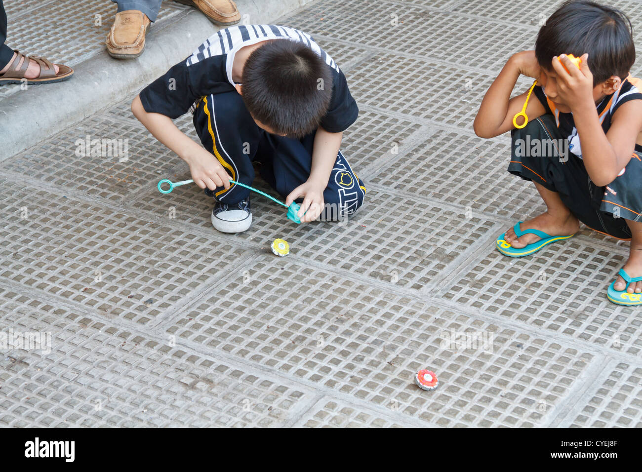 Children playing in the Street in Phnom Penh, Cambodia Stock Photo - Alamy