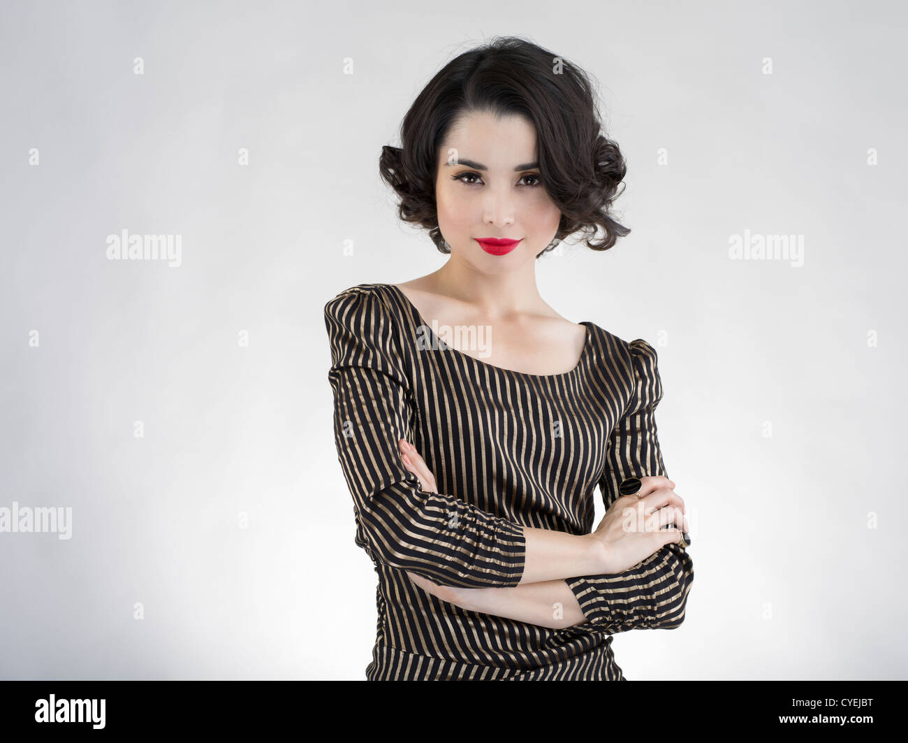 Young beautiful Japanese American woman with pale skin and red lipstick, black and gold striped dress Stock Photo - Alamy Young beautiful Japanese American woman with pale skin and red lipstick, black and gold striped dress Stock Photo - Alamy