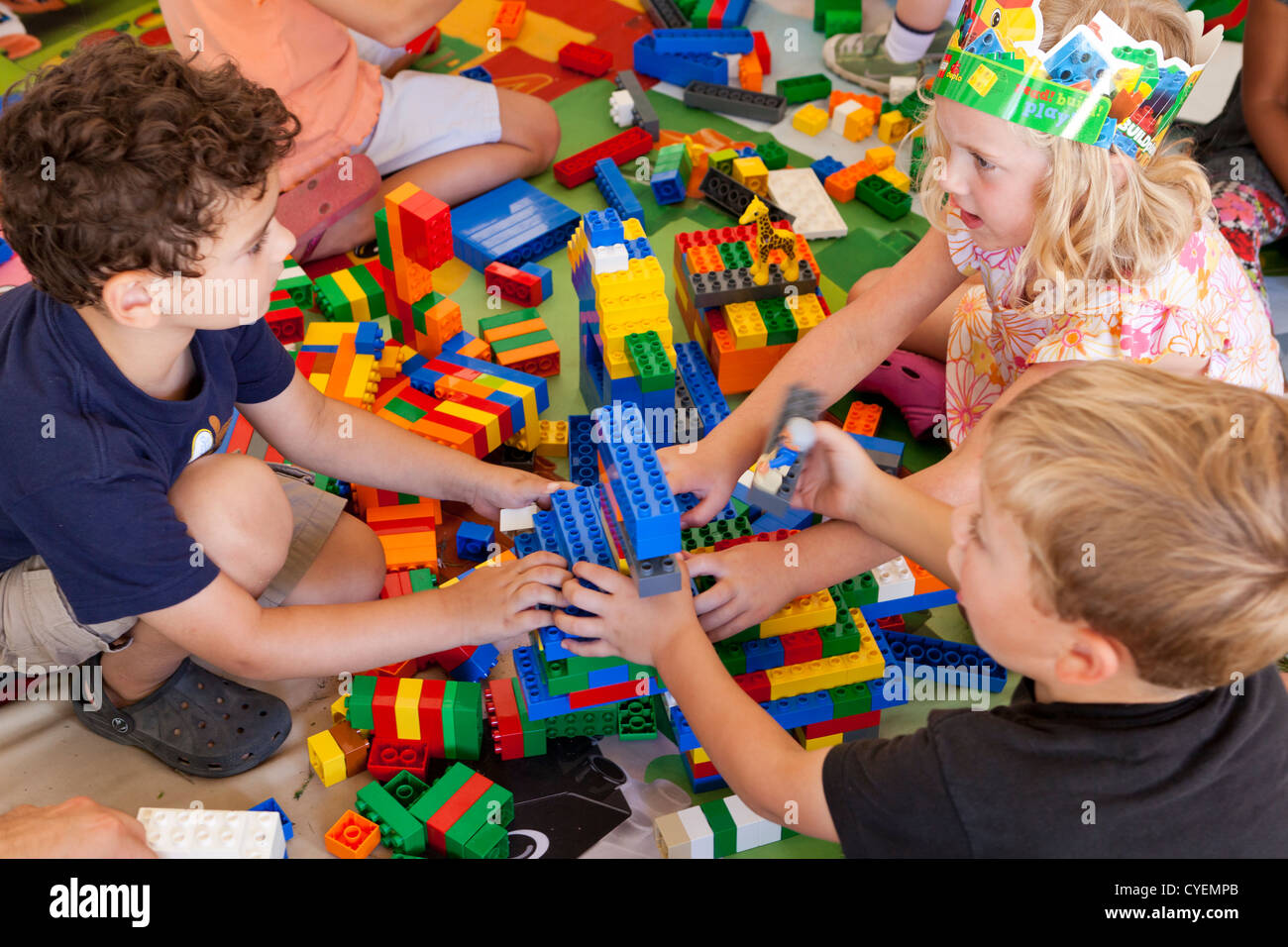 Caucasian children playing with Legos Stock Photo