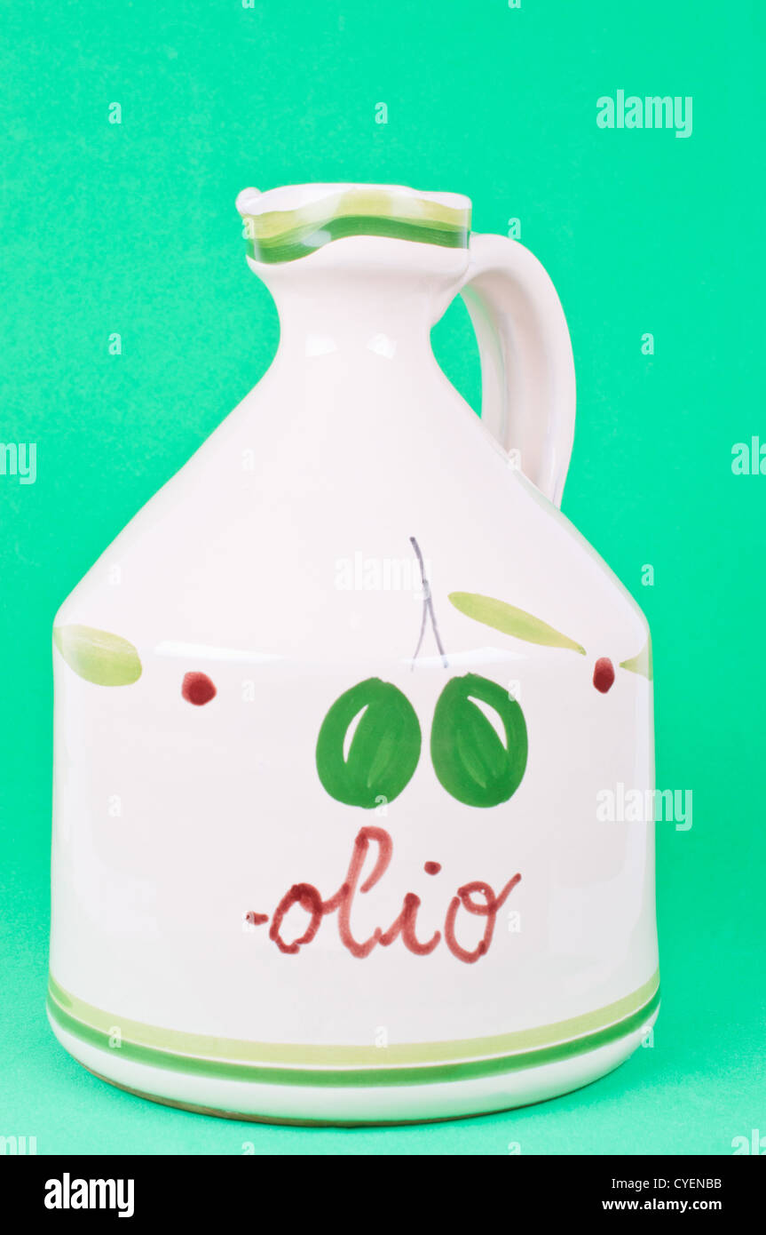 Bottle of olive oil on the green background Stock Photo - Alamy