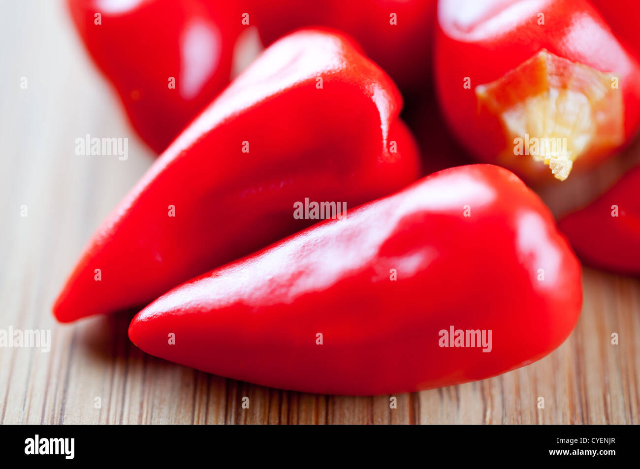 Canned chili pepper on a cutting board close up Stock Photo - Alamy