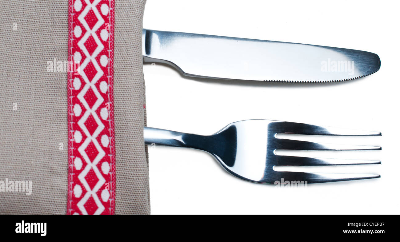 Knife and fork on gray napkin close up Stock Photo