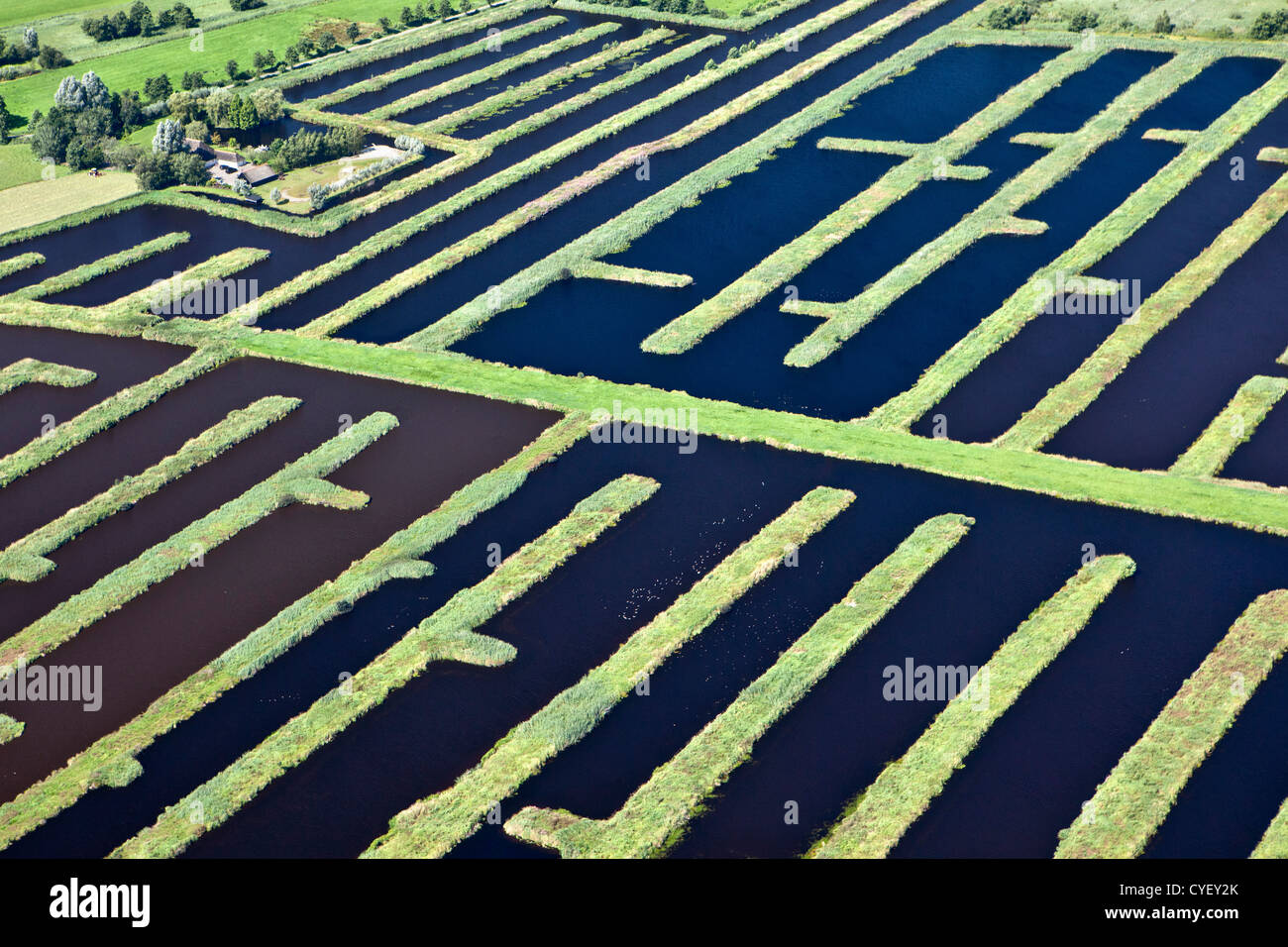 The Netherlands, Spanga, Landscape of water and small strips of land as a result of digging peat. Aerial. Stock Photo