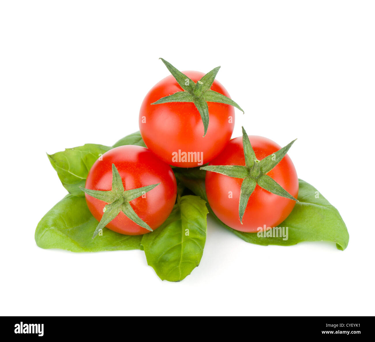 Cherry tomatoes and basil leafs. Isolated on white background Stock ...