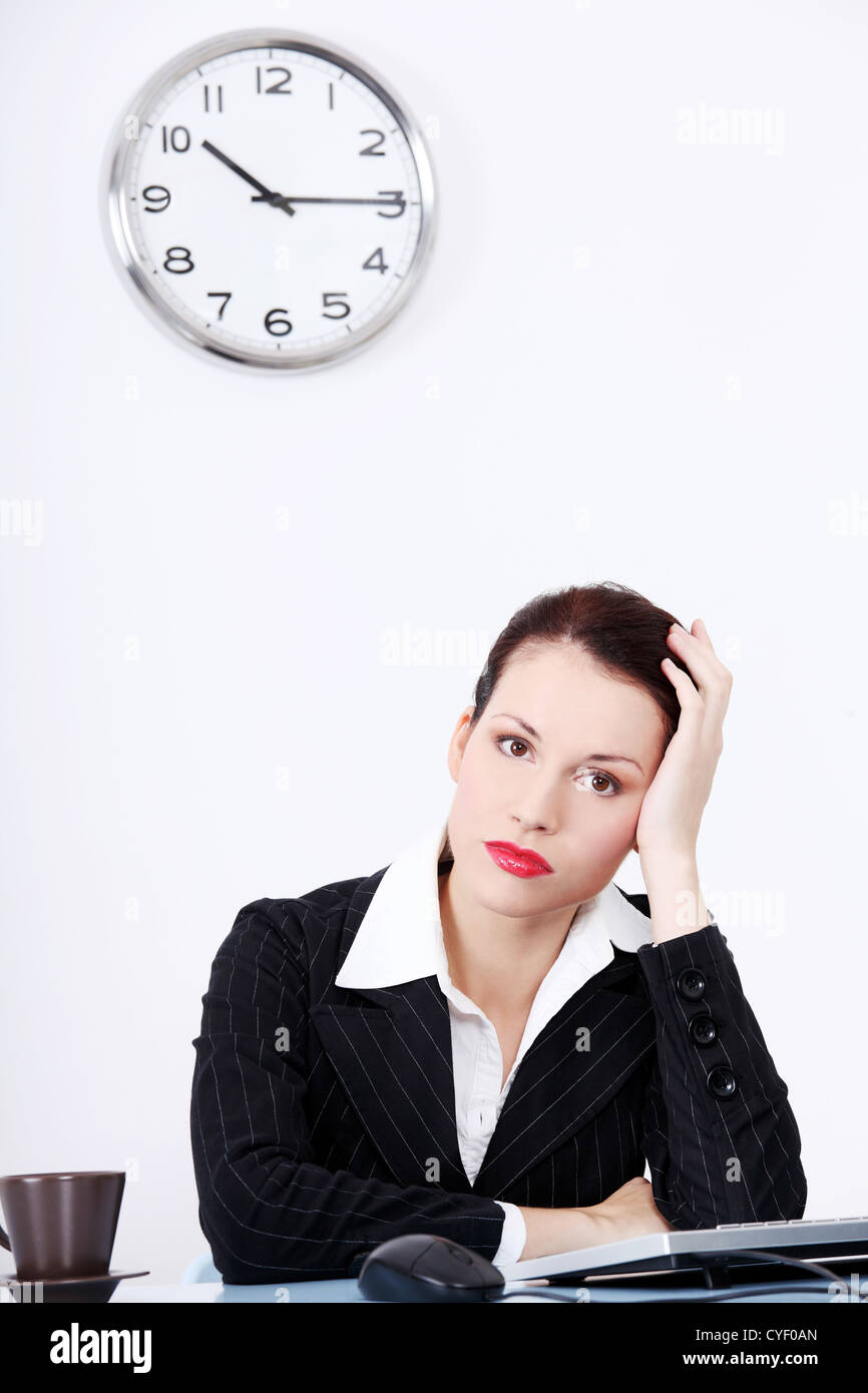 Pretty caucasian tired businesswoman sitting in the office Stock Photo ...
