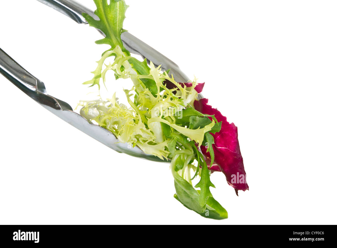 Tongs with salad leaves isolated over white background Stock Photo Alamy