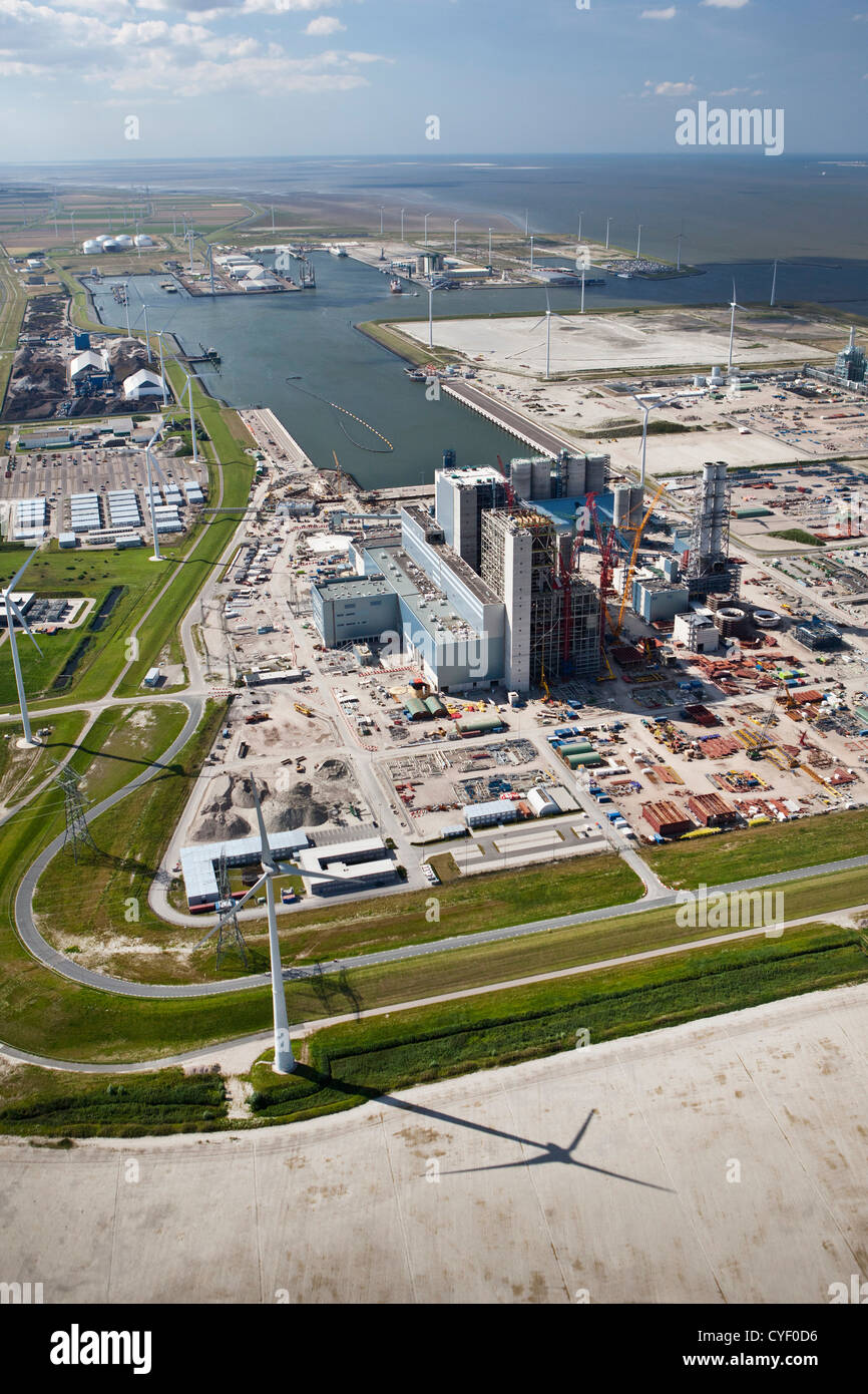 The Netherlands, Eemsmond, Port, harbor called Eemshaven. Construction of coal power plant. Aerial. Stock Photo