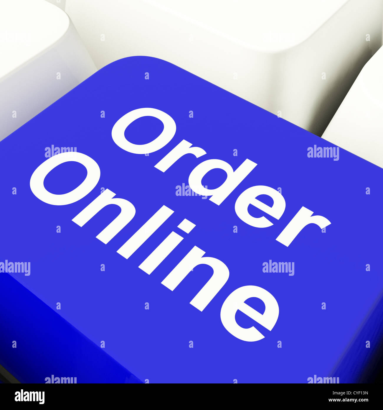 Order Online Computer Key In Blue For Buying On The Internet Stock Photo