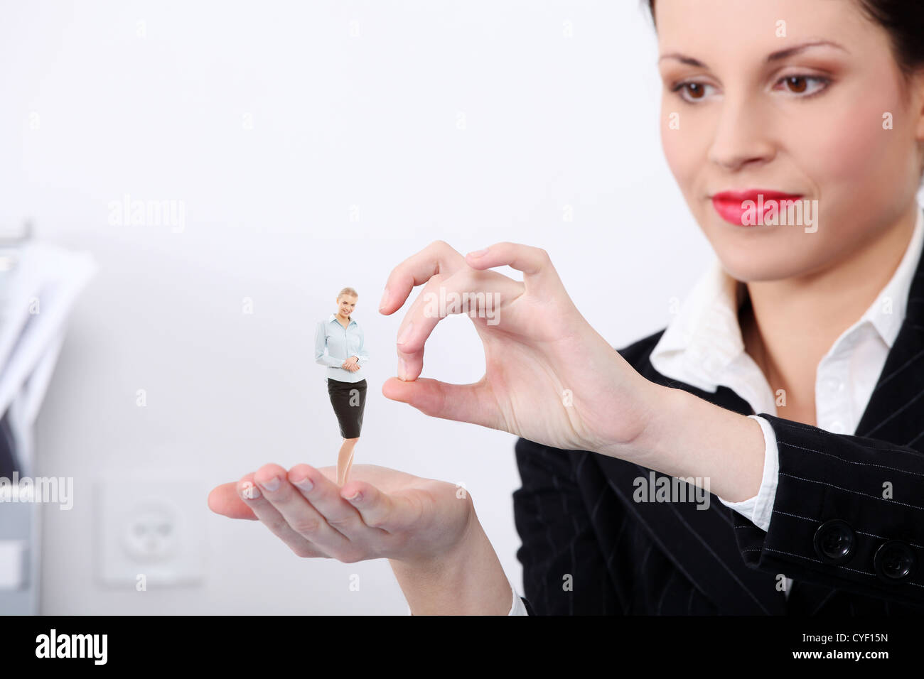 Businesswoman throwing a subordinate out of work. Stock Photo