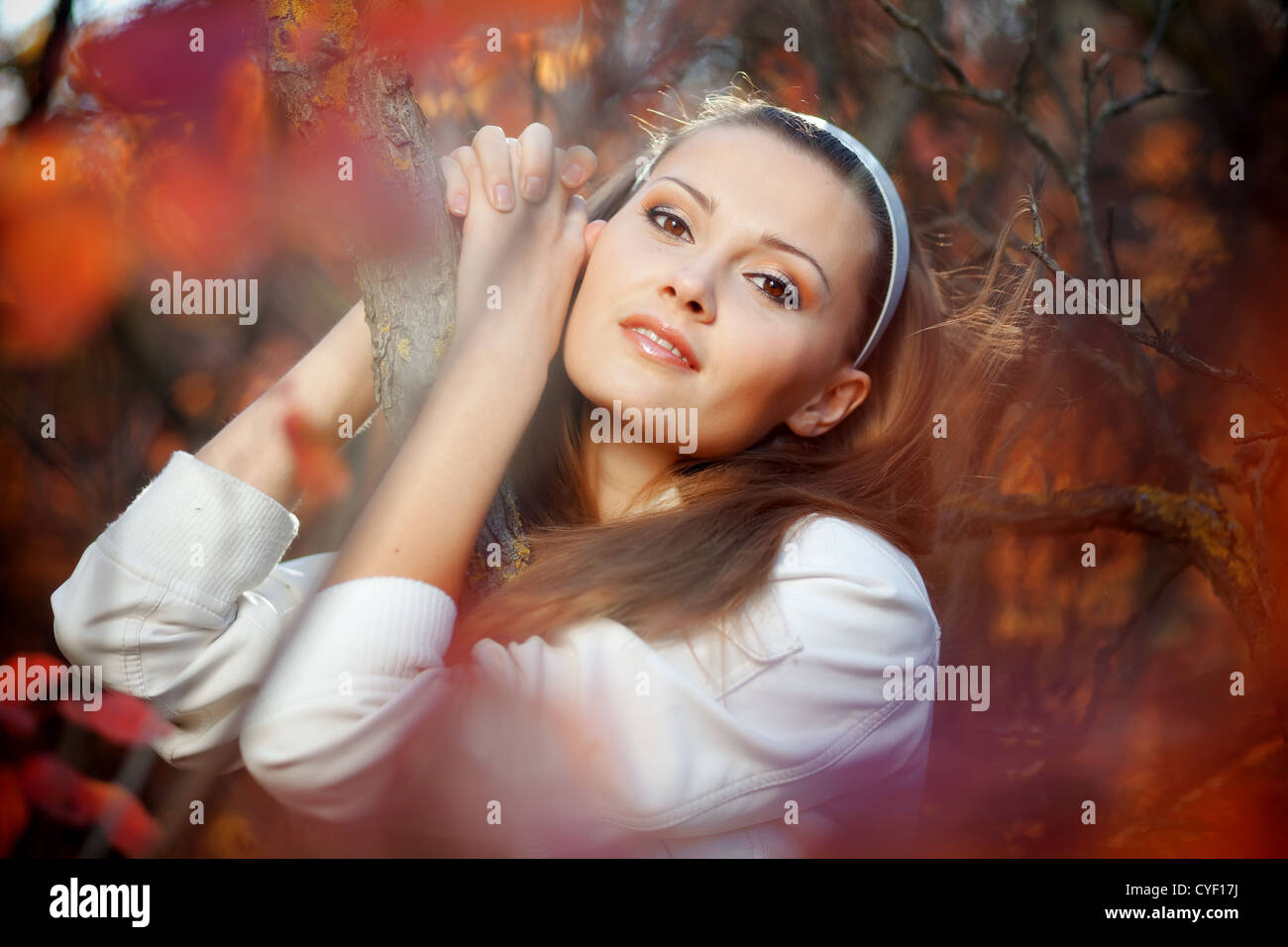Portrait of beautiful girl in autumn park Stock Photo - Alamy