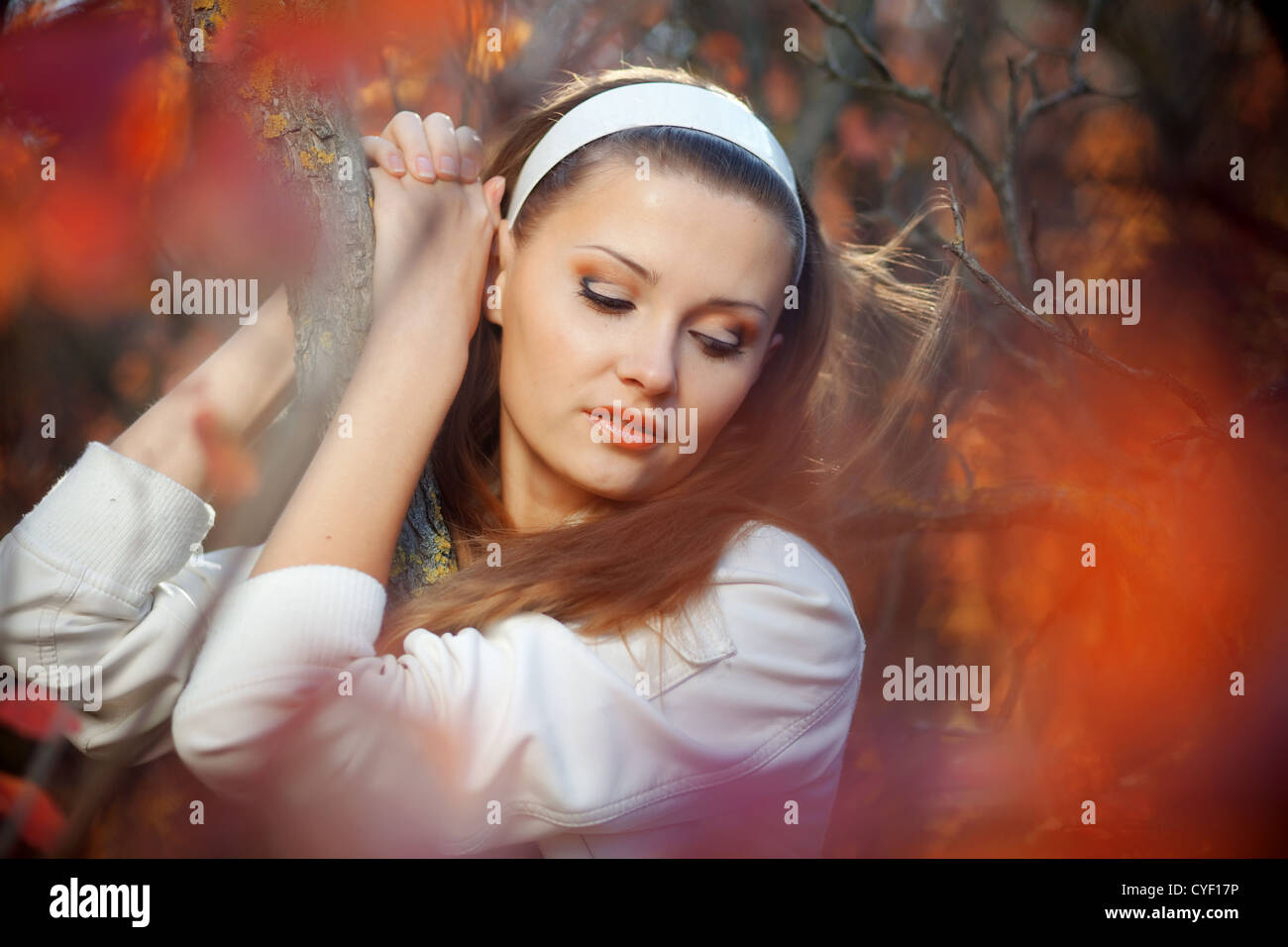 Portrait of beautiful girl in autumn park Stock Photo - Alamy