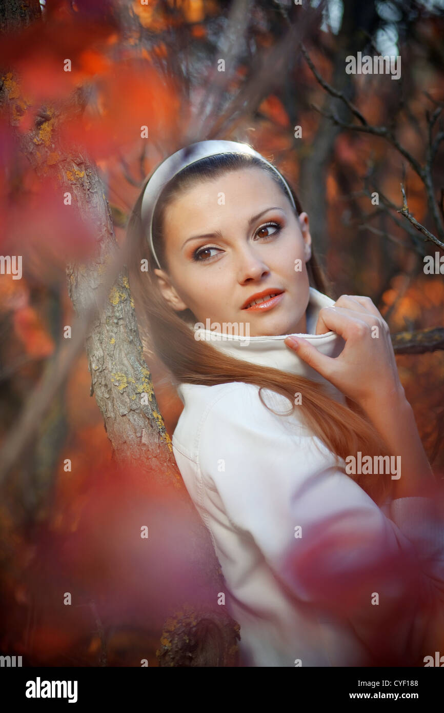 Portrait of beautiful girl in autumn park Stock Photo - Alamy