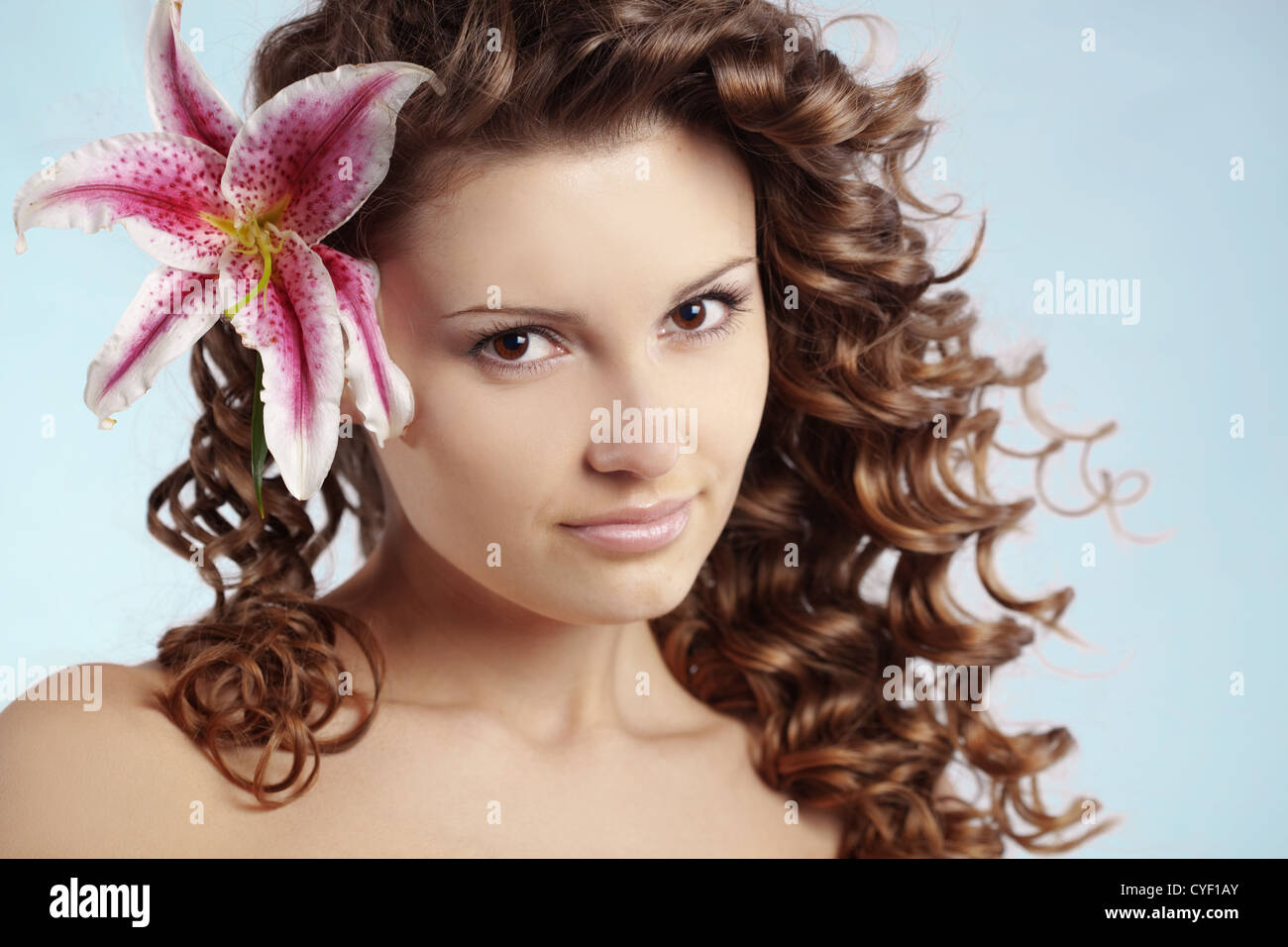 Portrait of very cute young woman with healthy curly hair Stock Photo ...