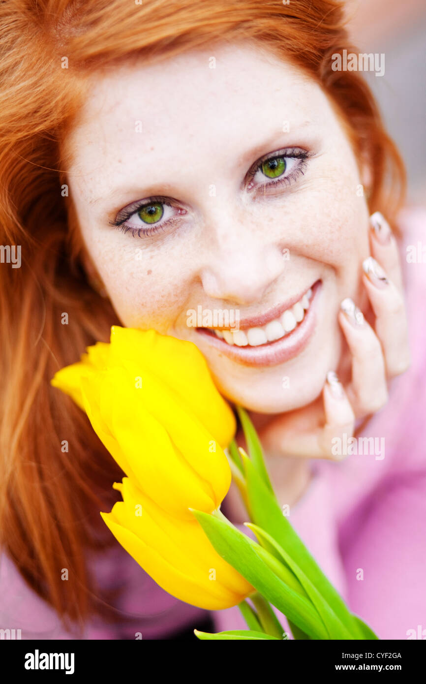 Close-up face of beautiful smiling girl with spring flowers Stock Photo ...
