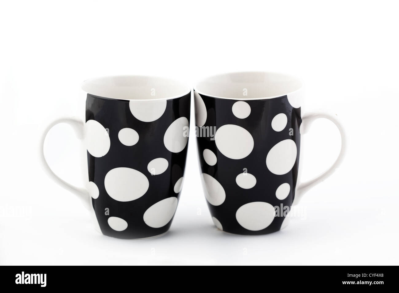 Two polka dot cups isolated on white Stock Photo