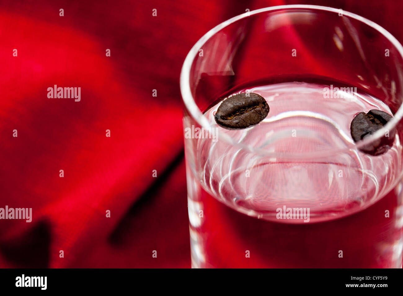 glass of sambuca with coffee beans Stock Photo Alamy