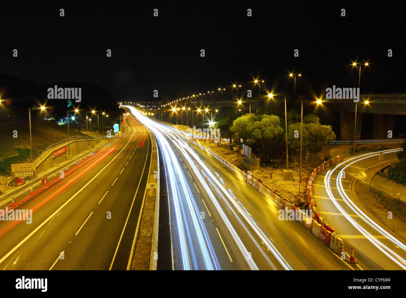 Traffic through downtown of Hong Kong at night Stock Photo - Alamy